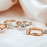 Assortment of gold engagement rings including yellow, white and rose gold options with various diamond cuts