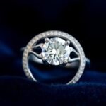 Beautiful silver engagement ring with diamond on velvet background