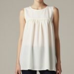 Classic babydoll top with empire waistline and flowy silhouette