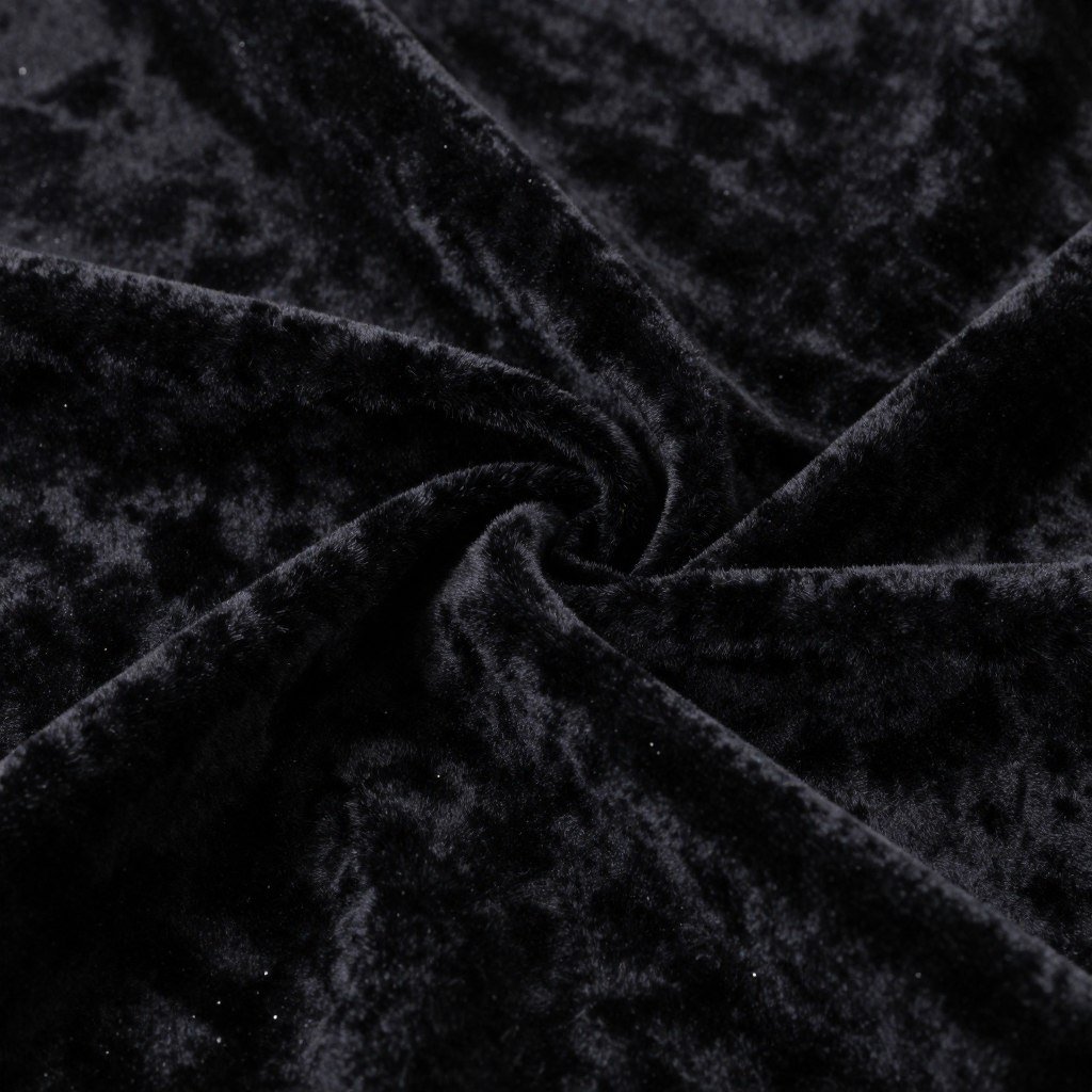 Close-up of black velvet fabric showing its plush, luxurious texture