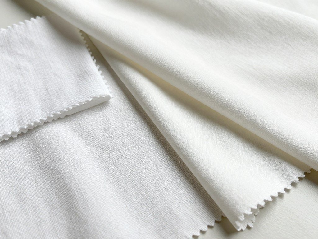 Different white fabric swatches showing various textures