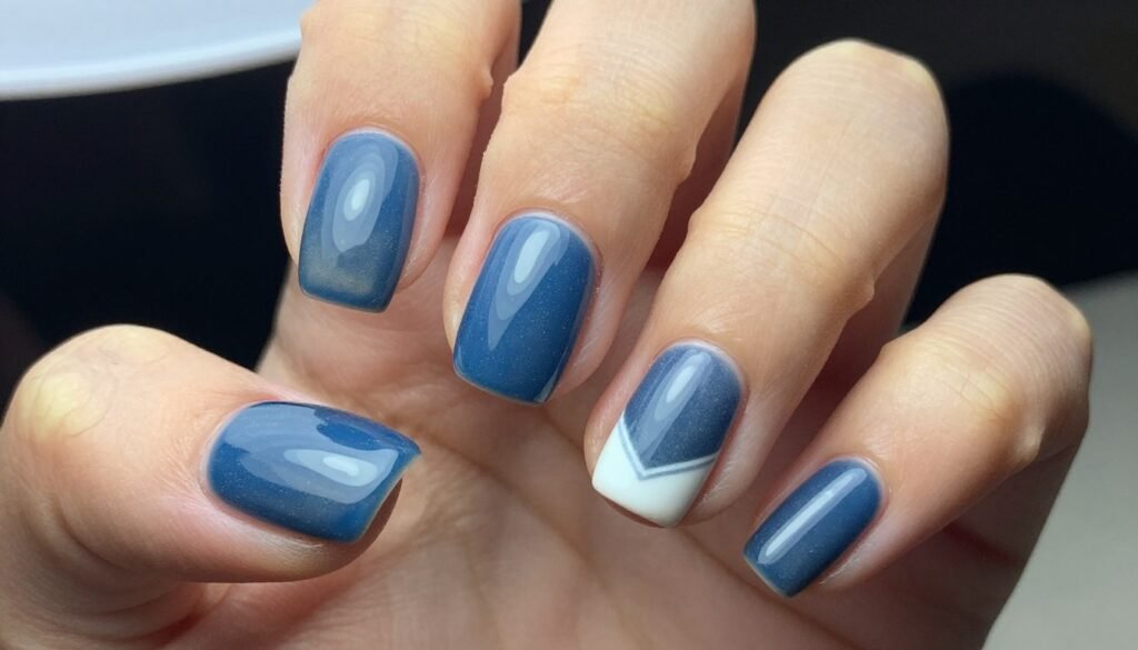 Dusty blue manicure with white geometric accent