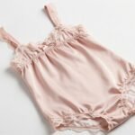 Elegant silk babydoll dress nightwear in soft pink with lace trim details