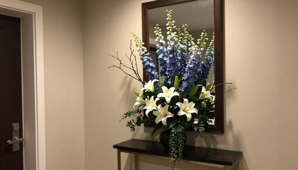 A welcoming entryway featuring a statement fake flowers decor arrangement on a console table A welcoming entryway featuring a statement fake flowers decor arrangement on a console table