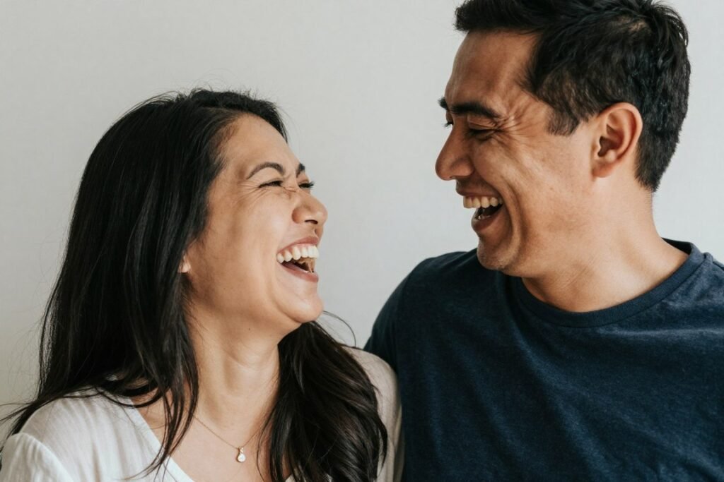 Candid natural anniversary photo with couple laughing together Candid natural anniversary photo with couple laughing together