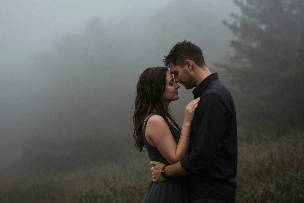 Couple in atmospheric weather conditions for dramatic save the date photo