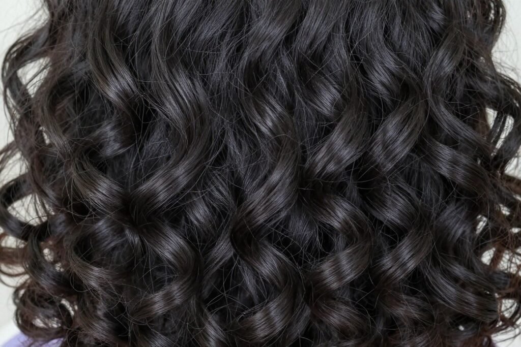 Defined natural curls bridesmaid hairstyle