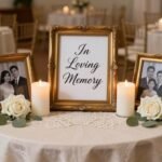 Elegant memorial table with framed photos and white candles at wedding reception