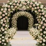 Elegant wedding entrance with floral arch and pathway