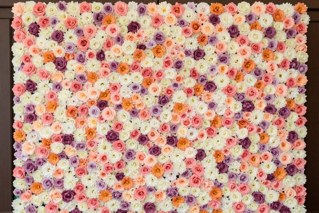Floral wall photo backdrop for bridal shower with fresh flowers