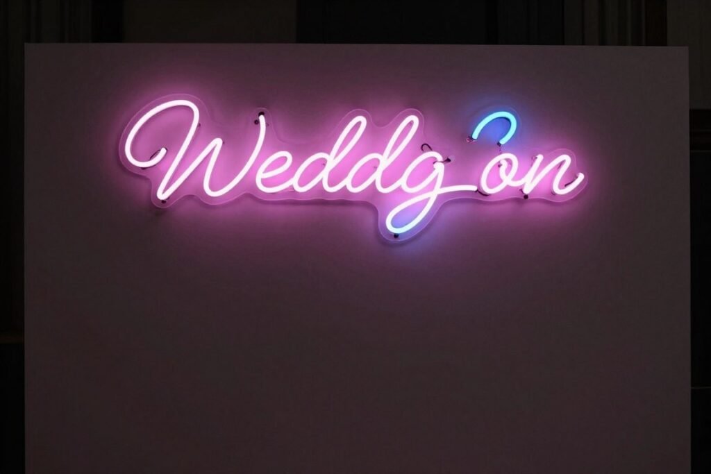 Neon sign backdrop decoration with a custom message for a wedding reception