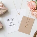 Simple bridesmaid proposal gifts arranged on white marble surface