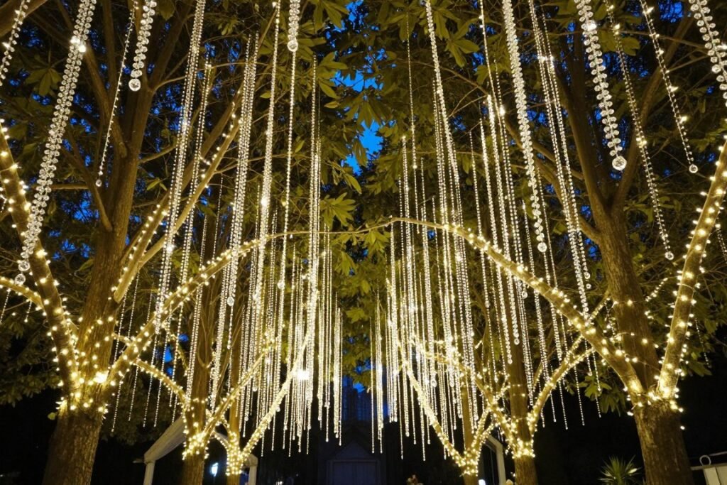 Trees decorated with hanging crystals and fairy lights for romantic outdoor wedding Trees decorated with hanging crystals and fairy lights for romantic outdoor wedding