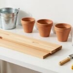 Various materials for DIY outdoor planters including wood, concrete, metal, and plastic containers arranged on a workbench