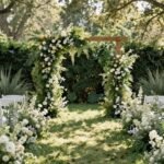Wedding aisle decorated with greenery and wildflowers in a garden setting