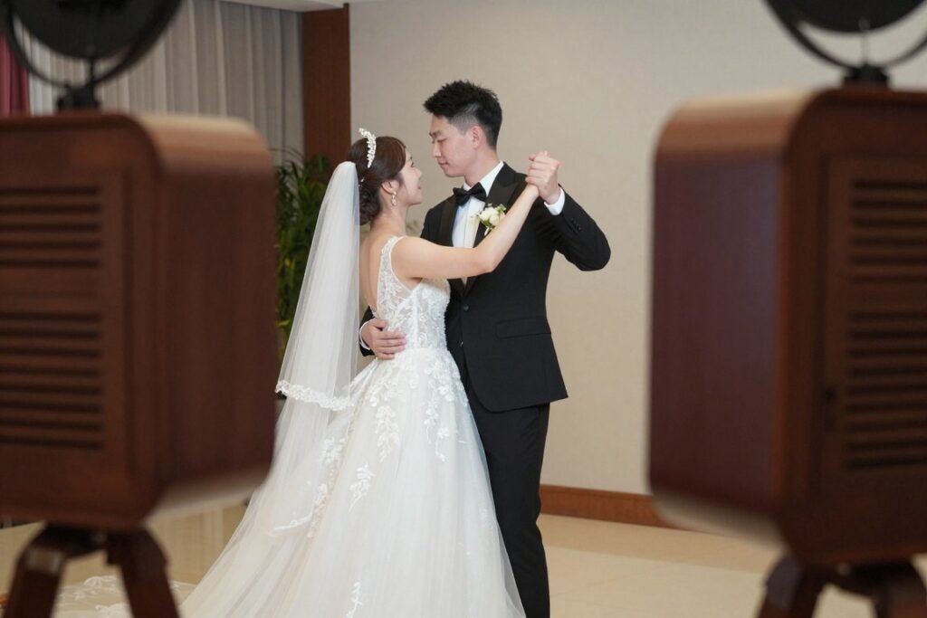 bride and groom in first dance pose inside wedding photobooth