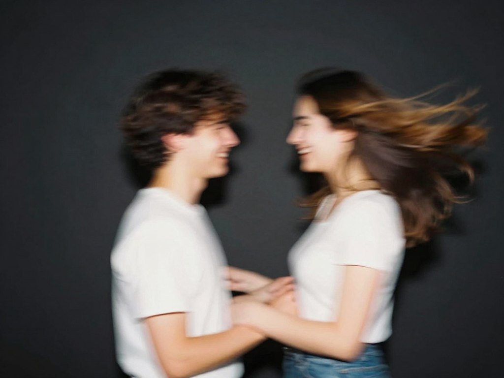 couple in motion creating artistic blur effect in photobooth