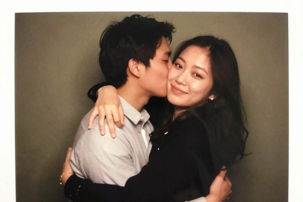 couple in natural comfortable embrace in photobooth