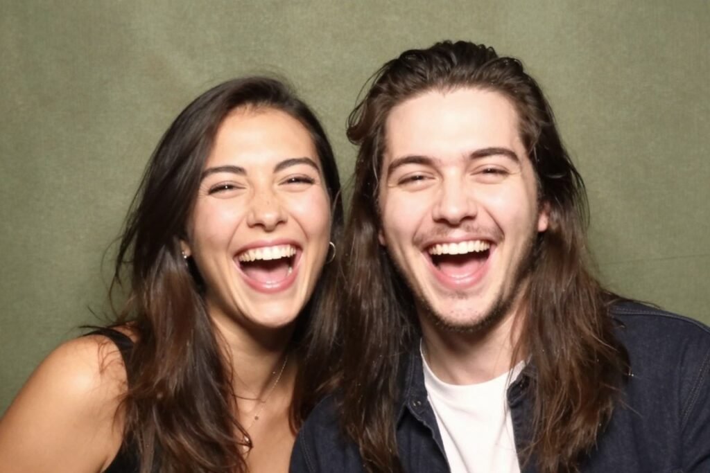 couple laughing naturally together in candid photobooth moment