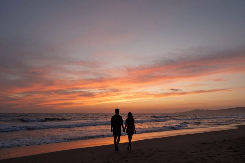 couple walking on beach during sunset