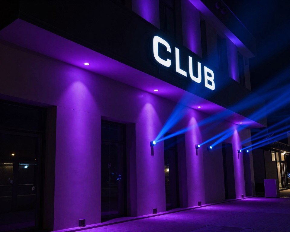 dramatic uplighting enhancing club exterior signage