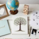 elegant wedding guest book alternatives display with various creative options including frames, globes, and decorative pieces arranged on vintage table