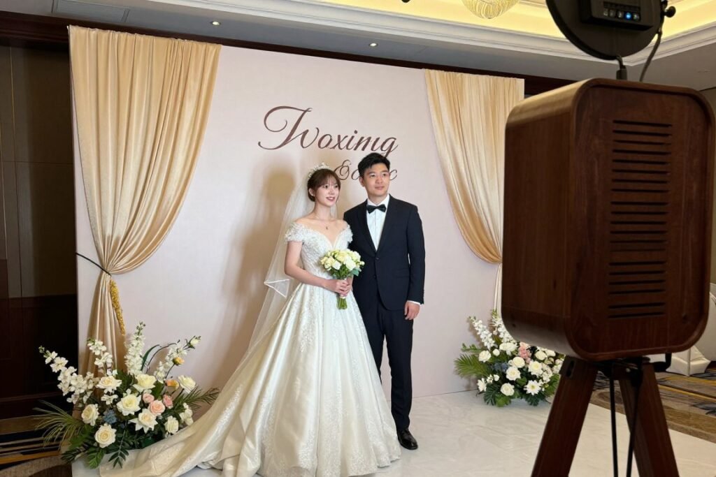 elegant wedding photobooth setup with custom backdrop