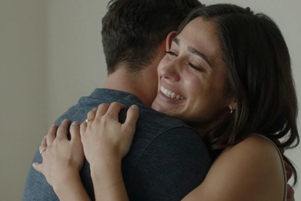 emotional moment during private proposal with couple embracing