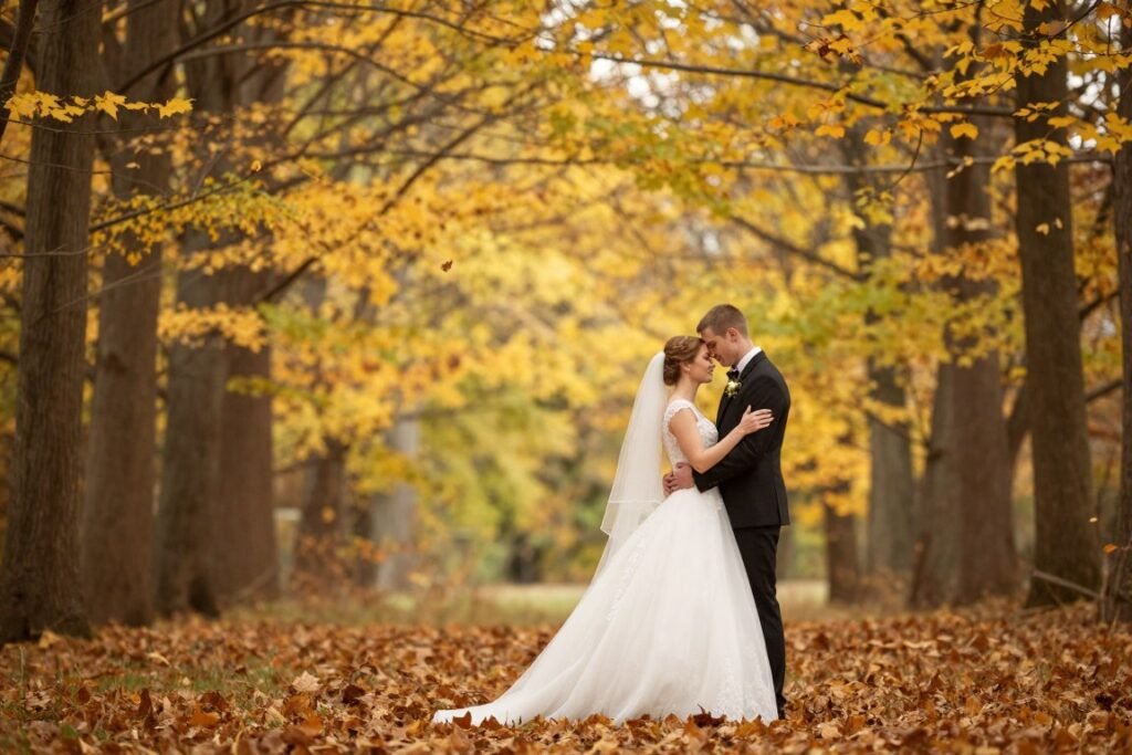 fall wedding couple portrait in autumn forest