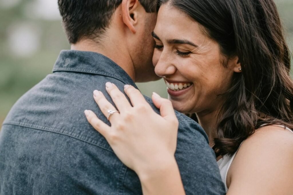 newly engaged couple embracing after private proposal