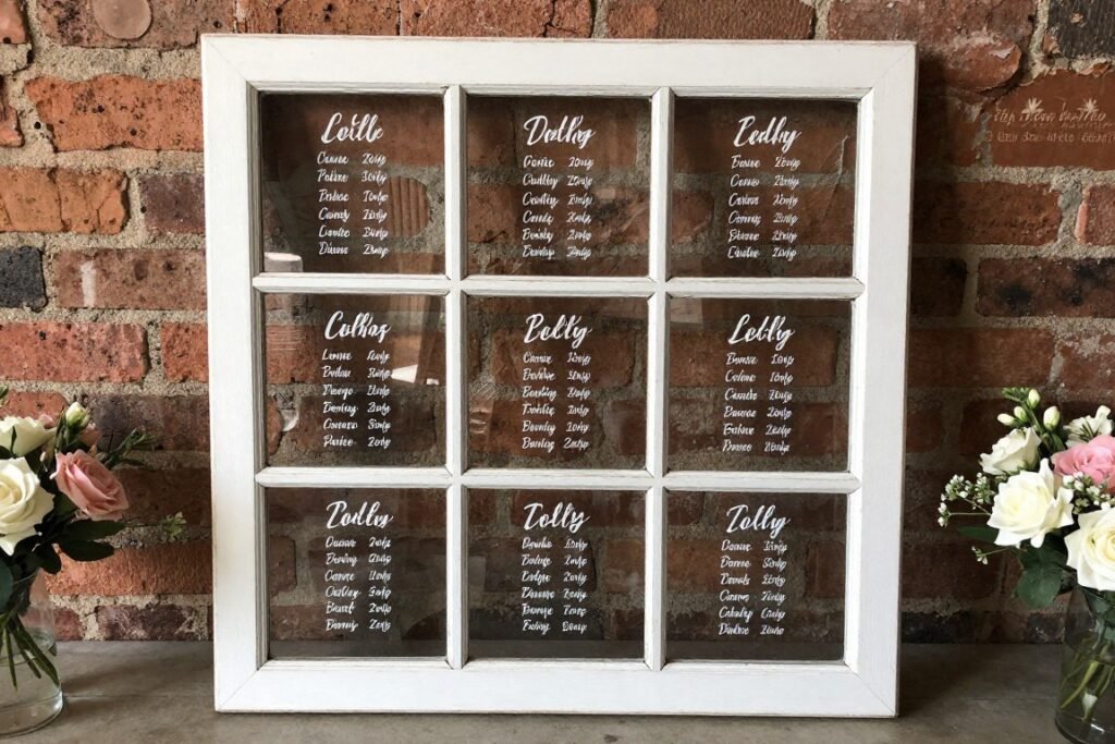 vintage window seating chart wedding ideas with calligraphy on glass panes