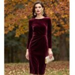 autumn wedding guest outfit featuring burgundy midi dress with gold accessories