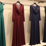 elegant november wedding guest dress options displayed on mannequins