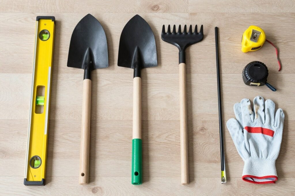 Essential tools for fire pit construction laid out