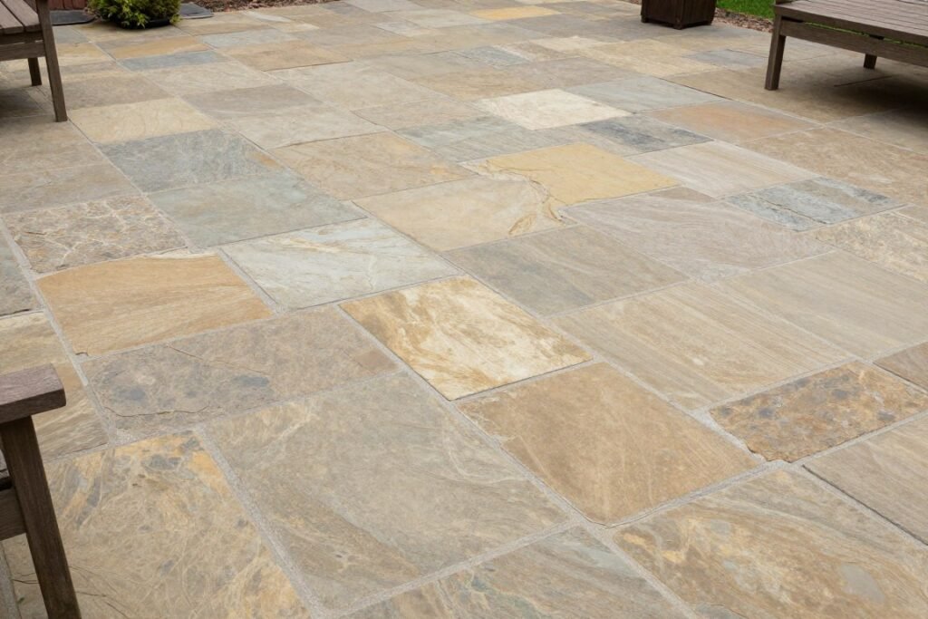 flagstone patio with irregular shaped stones in small backyard setting