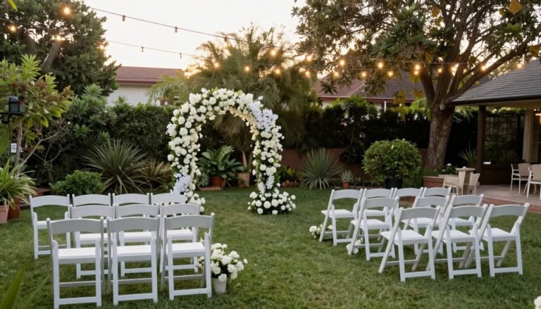 intimate small backyard wedding ceremony setup with white chairs and floral arch
